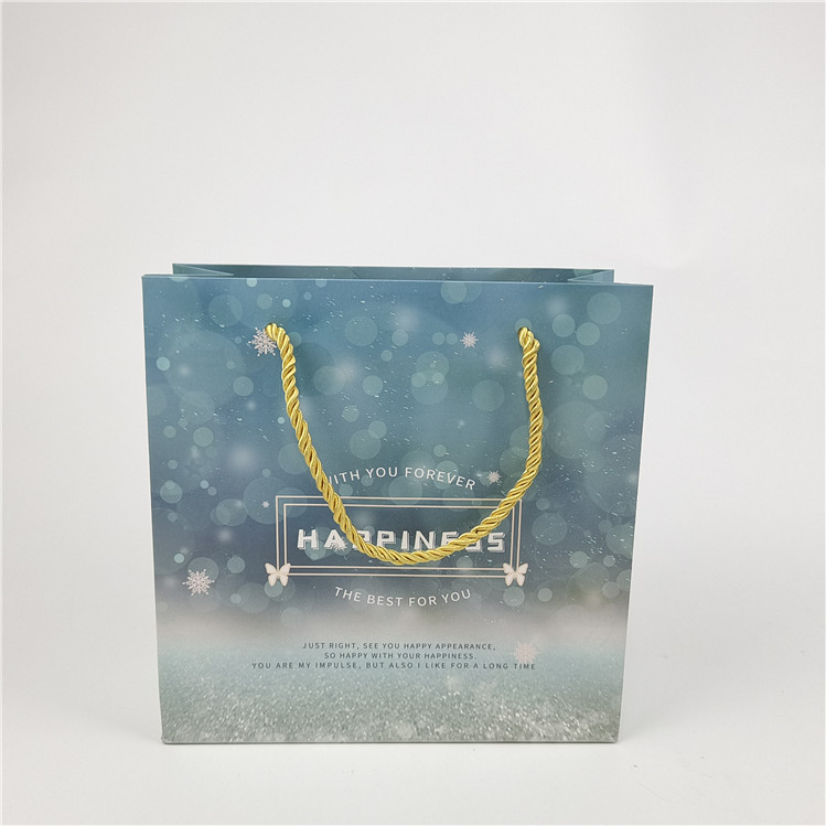 Наиболее продаваемый Перерабатываемый экологически чистый логотип Печатный бумажный пакет для покупок Упаковка Белая 110 грамм Повторное использование